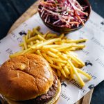 photo of burger beside fries