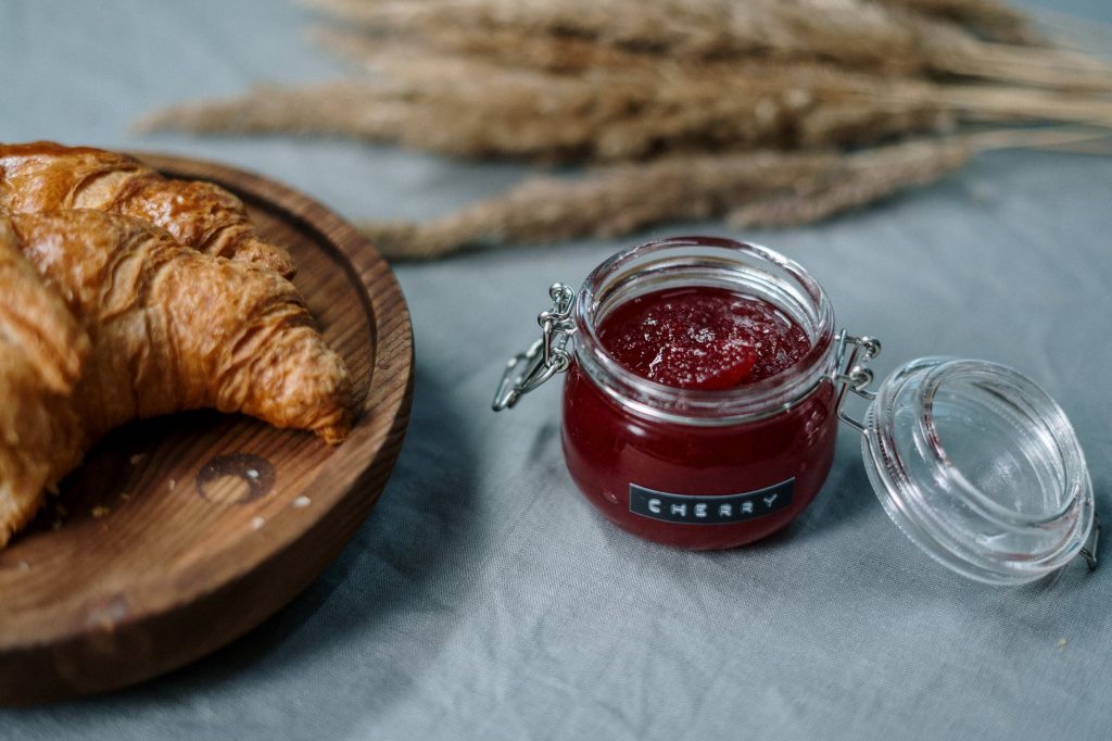 clear glass jar with red liquid inside