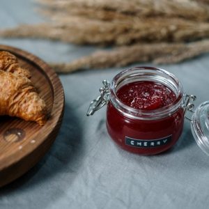 clear glass jar with red liquid inside