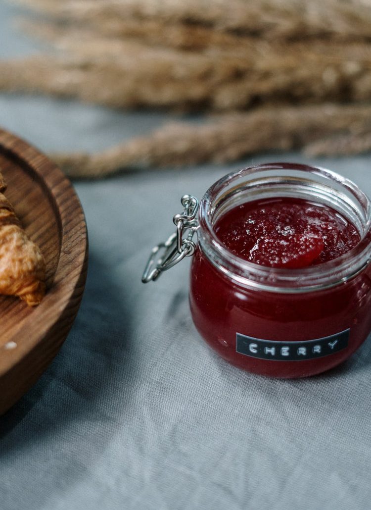 clear glass jar with red liquid inside